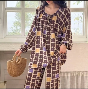 Detail of floral printed cotton pajama set with drawstring neckline and elastic cuffs