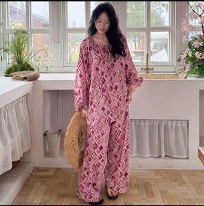 Pink and purple geometric patterned lounge set featuring drawstring collar detail