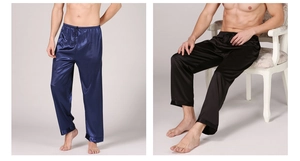 Detail showing smooth satin texture and elastic drawstring waistband on men's sleep pants