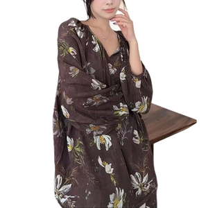 Women's floral cotton pajama set featuring long sleeves and deep brown flower print