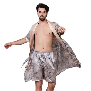 Men's silk-like pajama set featuring navy robe and shorts with golden pattern print