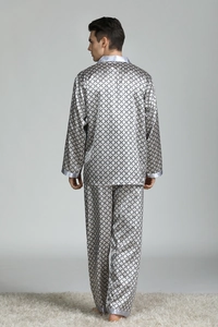Rear view of men's silver-gray silk pajama set featuring geometric ring patterns