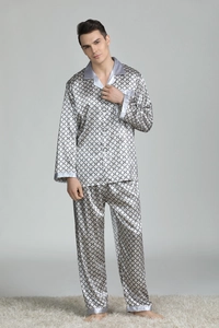 Detail of men's silk-like pajamas showing geometric print and satin collar stitching