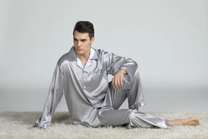 Detail of silver silk-like satin pajamas with diamond pattern and classic lapel collar