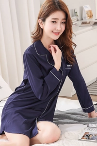 Detail of navy silk satin nightshirt with white contrast piping and chest pocket