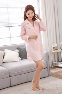 Detailed view of light pink silk satin nightshirt with button-down collar and chest pocket
