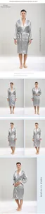 Detail of men's silver silk-like robe featuring shawl collar and micro-geometric pattern
