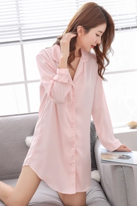 Close-up of soft pink silk satin long-sleeve nightgown with button-down collar