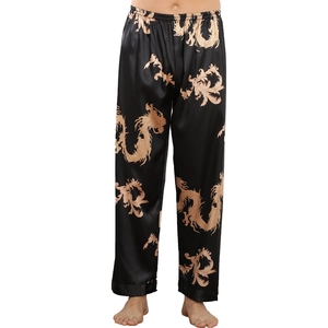 Men's black silk satin pajama pants featuring a golden Chinese dragon pattern design