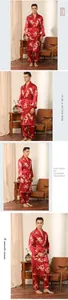 Close-up of men's red silk pajamas featuring intricate golden dragon pattern and lapel robe