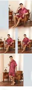 Detail view of burgundy satin pajama set featuring geometric patterns and pink contrast piping