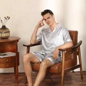 Men's silver-grey satin pajama set with geometric print and short sleeves