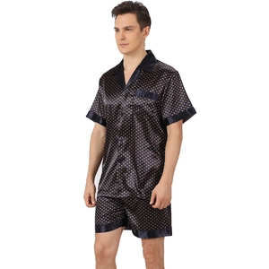 Men's navy silk satin pajama set with orange polka dots featuring short sleeve and shorts