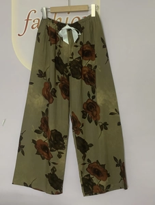 Detail of floral wide leg lounge pants with elastic waist and white ribbon bow