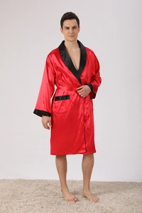 Detailed view of red silk robe featuring contrasting black trim and satin fabric