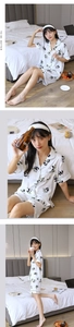 Detail of panda print pajamas set showing notched lapel and short sleeves on model