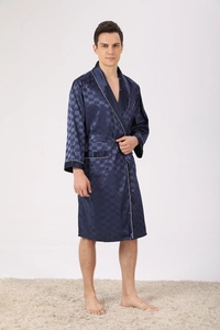 Detail of navy blue silk pajama robe showing checkered texture and white piping trim