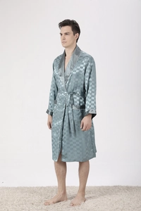 Detail view of men's blue silk satin robe showing striped jacquard texture and shawl collar
