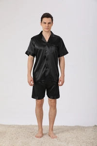 Detail view of black men's satin pajama set with short sleeves and matching shorts