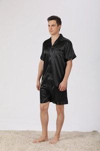 Detail of men's satin pajama set featuring button-up shirt and elastic waist shorts