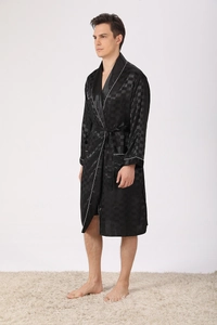 Detail of black silk-like men's robe featuring a subtle checkered pattern and white piping