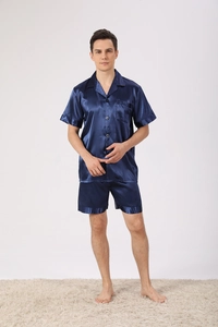 Close-up of men's navy blue satin pajama set featuring short sleeves and classic lapels