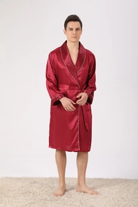 Detail of burgundy satin robe featuring vertical stripes and white piping on the shawl collar