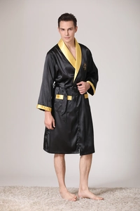 Detail of gold crown embroidery and satin finish on black silk men's luxury bathrobe