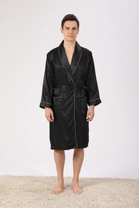 Detailed view of black satin men's robe with vertical stripes and white piping contrast