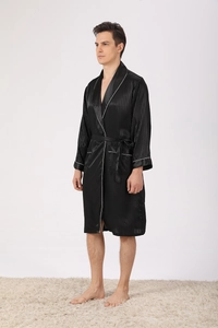 Detail of men's black satin silk bathrobe featuring vertical stripes and white piping trim