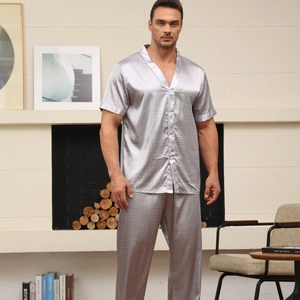 Men's silver satin pajama set with short-sleeved top and long pants in geometric pattern