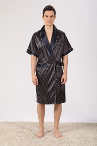 Detail of navy blue satin robe with orange polka dots and contrasting piping texture