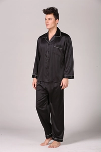 Detail of premium black silk pajama set with white piping and long sleeve design
