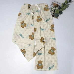 Detailed view of lightweight bear print pajama pants with elastic waist and satin drawstring