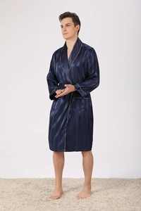 Detail of navy blue striped silk pajamas with white piping and belted waist design