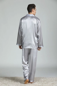 Detail view of the silver-grey silk pajama set with geometric patterns on the back side