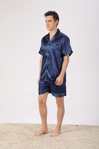 Detail of dark blue silk-like pajama set with short sleeves and white piping trim