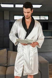 Detailed view of white silk satin men robe featuring black contrast shawl collar and belt