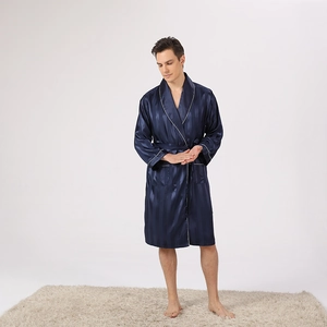 Detail of navy blue silk bathrobe featuring white piping and vertical stripe texture