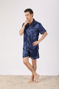 Detail of navy blue satin pajama set for men with short sleeves and white piping trim