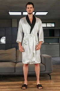 Detail of silk satin men's robe featuring a black shawl collar and white fabric
