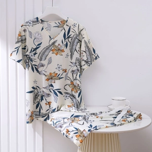 Detail of floral V-neck top and shorts lounge set in light cotton-viscose fabric