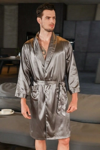 Close-up of dark grey silk satin men's bathrobe featuring white contrast piping and dual pockets