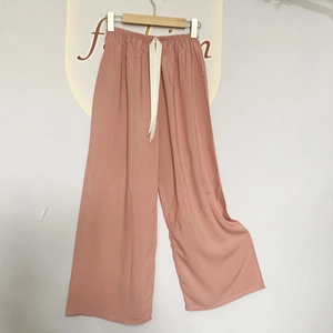 Breathable dusty pink wide-leg sleep pants with elastic waistband and decorative drawstring