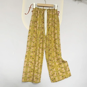 Floral wide-leg pajama pants in ginger yellow with breathable cotton fabric and drawstring