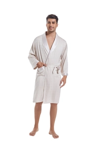 Close-up of champagne satin men's bathrobe with shawl collar and textured grid pattern