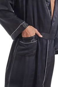 Detailed view of men's black satin bathrobe with subtle grid texture and white piping