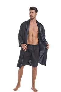 Detail of black satin robe with subtle grid pattern and white contrast piping trim