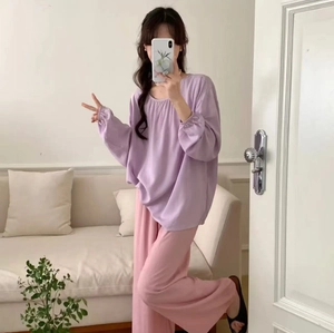 Detailed view of the lavender long-sleeved top and pink wide-leg trousers pajamas set