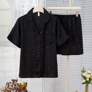 Women's ice silk short-sleeve pajama set in black with delicate white star patterns